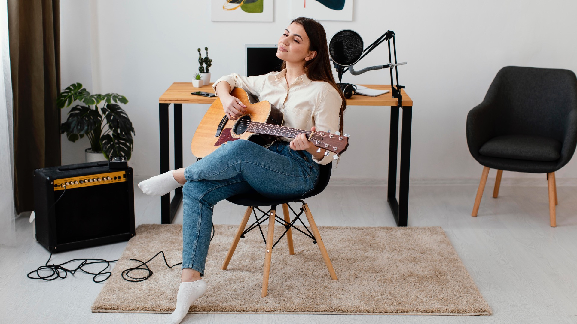 front-view-female-musician-playing-acoustic-guitar-home